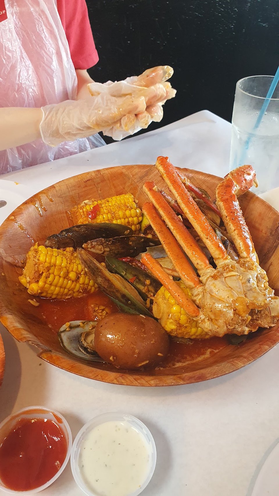Menu board showing seafood boils, sides, and soft drinks.
