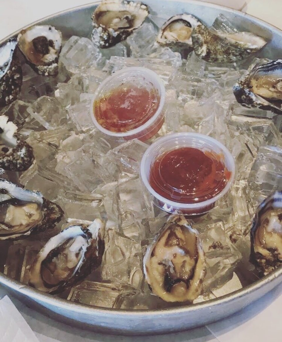 Restaurant menu highlighting Cajun seafood and shareable plates.