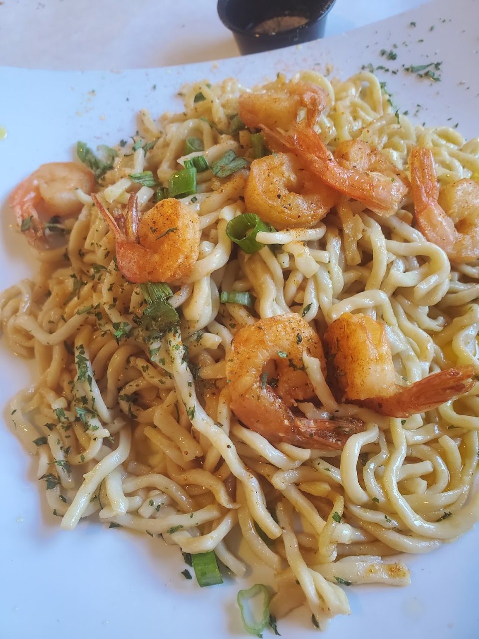 Restaurant menu highlighting Cajun seafood and shareable plates.